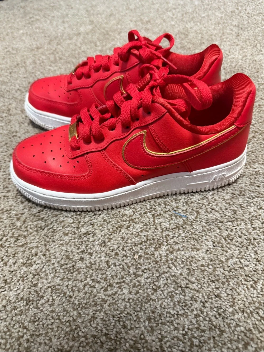 Nike Red Low-Top Sneakers with Gold Swoosh